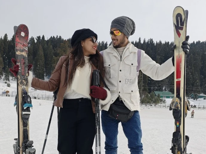 Himanshu skiing with his partner